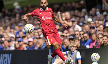 Liverpool’s new era under Slot begins with a win at Ipswich and a scoring record for Salah