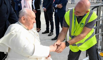 Pope Francis, seated on a wheelchair, boards his plane heading to Indonesia on September 2, 2024 at Rome’s Fiumicino airport.