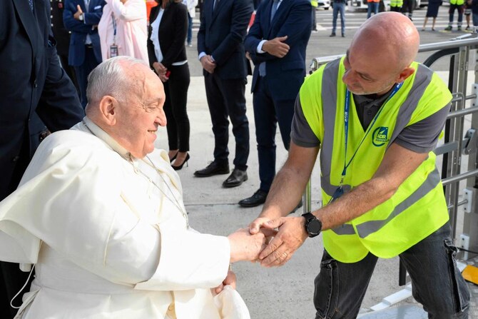 Pope Francis, seated on a wheelchair, boards his plane heading to Indonesia on September 2, 2024 at Rome’s Fiumicino airport.